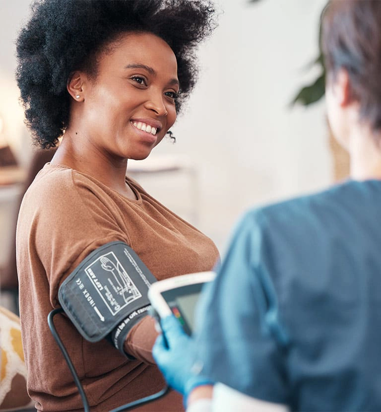 woman getting her blood pressure read
